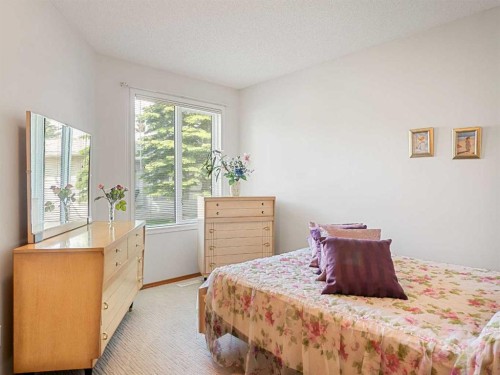 277 Arbour Cliff Close Nw, Calgary, AB - Indoor Photo Showing Bedroom