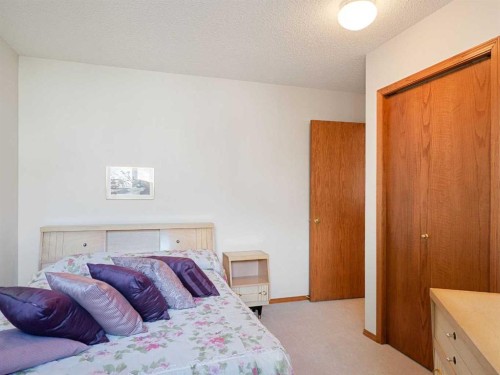 277 Arbour Cliff Close Nw, Calgary, AB - Indoor Photo Showing Bedroom
