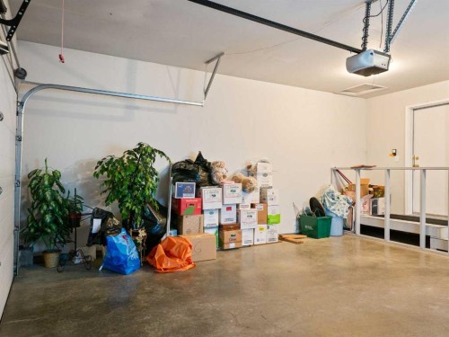 277 Arbour Cliff Close Nw, Calgary, AB - Indoor Photo Showing Garage