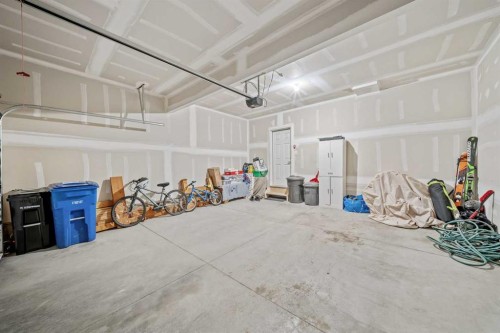 220 Windbury Lane Sw, Airdrie, AB - Indoor Photo Showing Garage