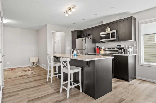 220 Windbury Lane Sw, Airdrie, AB - Indoor Photo Showing Kitchen With Upgraded Kitchen