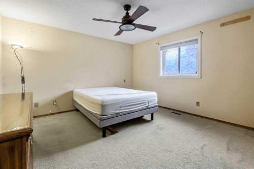 25 Downey Road, Okotoks, AB - Indoor Photo Showing Bedroom