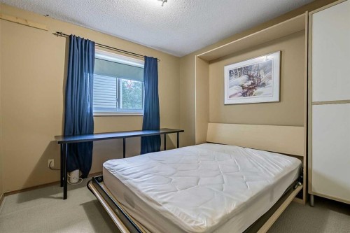 25 Downey Road, Okotoks, AB - Indoor Photo Showing Bedroom