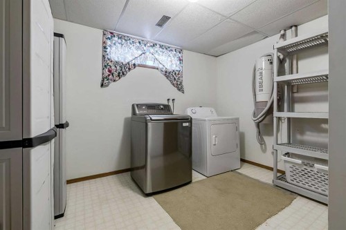 25 Downey Road, Okotoks, AB - Indoor Photo Showing Laundry Room
