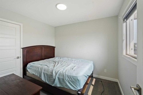 2320 Lancaster Heights Se, Airdrie, AB - Indoor Photo Showing Bedroom