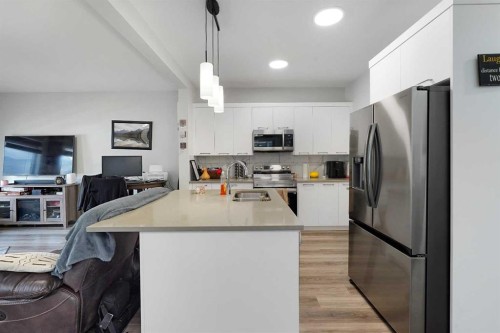2320 Lancaster Heights Se, Airdrie, AB - Indoor Photo Showing Kitchen With Stainless Steel Kitchen With Double Sink