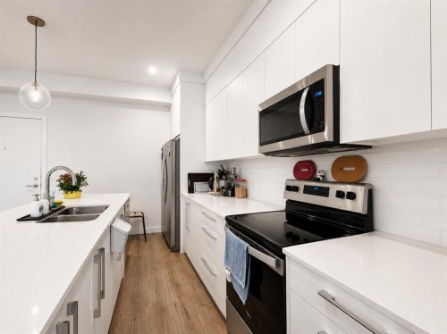 1614-60 Skyview Ranch Road Ne, Calgary, AB - Indoor Photo Showing Kitchen With Stainless Steel Kitchen With Double Sink With Upgraded Kitchen