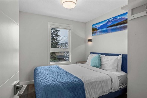 207-105 Kananaskis Way, Canmore, AB - Indoor Photo Showing Bedroom