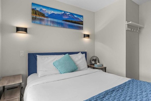 207-105 Kananaskis Way, Canmore, AB - Indoor Photo Showing Bedroom