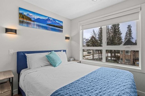 207-105 Kananaskis Way, Canmore, AB - Indoor Photo Showing Bedroom