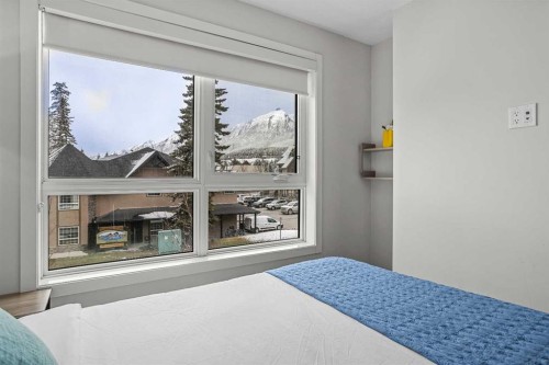 207-105 Kananaskis Way, Canmore, AB - Indoor Photo Showing Bedroom