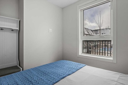 207-105 Kananaskis Way, Canmore, AB - Indoor Photo Showing Bedroom