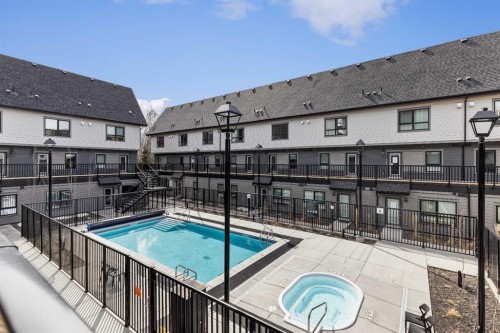 207-105 Kananaskis Way, Canmore, AB - Outdoor With In Ground Pool