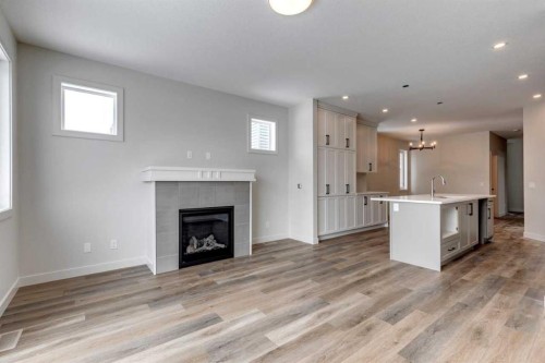 435 Rivercrest Road, Cochrane, AB - Indoor Photo Showing Living Room With Fireplace