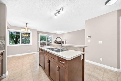 129-308 11 Avenue, High River, AB - Indoor Photo Showing Kitchen With Double Sink