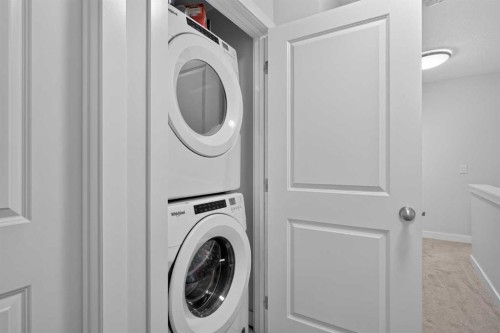 573 Canals Crossing Sw, Airdrie, AB - Indoor Photo Showing Laundry Room