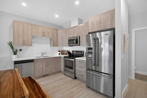 573 Canals Crossing Sw, Airdrie, AB - Indoor Photo Showing Kitchen With Stainless Steel Kitchen