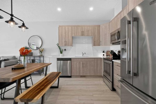 573 Canals Crossing Sw, Airdrie, AB - Indoor Photo Showing Kitchen With Stainless Steel Kitchen With Upgraded Kitchen