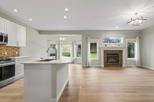 126 Chapman Close Se, Calgary, AB - Indoor Photo Showing Kitchen With Fireplace With Upgraded Kitchen
