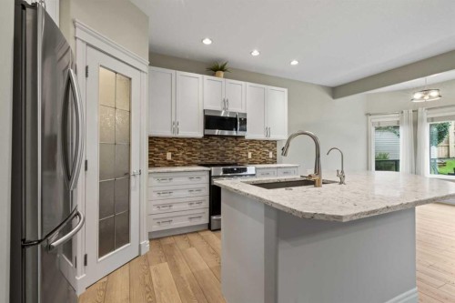 126 Chapman Close Se, Calgary, AB - Indoor Photo Showing Kitchen With Upgraded Kitchen