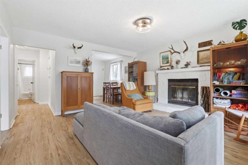 636 55 Avenue Sw, Calgary, AB - Indoor Photo Showing Living Room With Fireplace