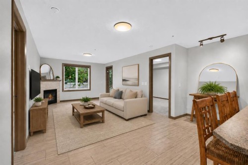 3111-310 Mckenzie Towne Gate Se, Calgary, AB - Indoor Photo Showing Living Room With Fireplace