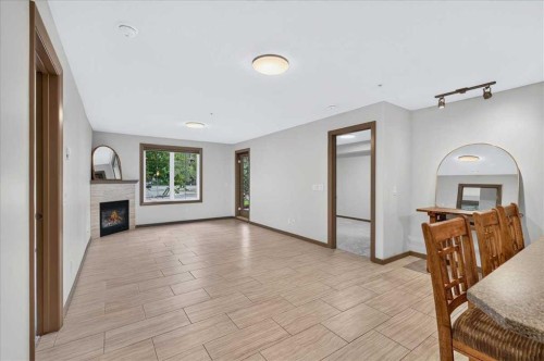 3111-310 Mckenzie Towne Gate Se, Calgary, AB - Indoor With Fireplace