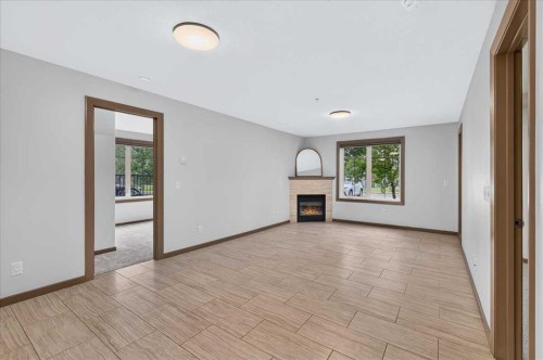3111-310 Mckenzie Towne Gate Se, Calgary, AB - Indoor With Fireplace