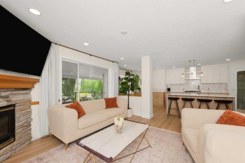 77 Citadel Ridge Green Nw, Calgary, AB - Indoor Photo Showing Living Room With Fireplace