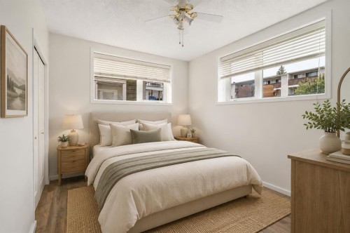 2-116 First Street, Cochrane, AB - Indoor Photo Showing Bedroom