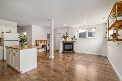 2-116 First Street, Cochrane, AB - Indoor With Fireplace