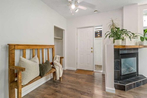 2-116 First Street, Cochrane, AB - Indoor With Fireplace