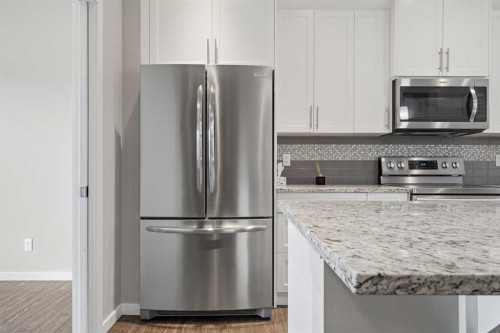 75 Legacy Glen Row Se, Calgary, AB - Indoor Photo Showing Kitchen With Stainless Steel Kitchen With Upgraded Kitchen