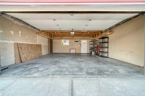 75 Legacy Glen Row Se, Calgary, AB - Indoor Photo Showing Garage