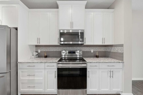 75 Legacy Glen Row Se, Calgary, AB - Indoor Photo Showing Kitchen With Stainless Steel Kitchen With Upgraded Kitchen