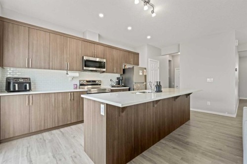 260 Carringham Way Nw, Calgary, AB - Indoor Photo Showing Kitchen With Upgraded Kitchen