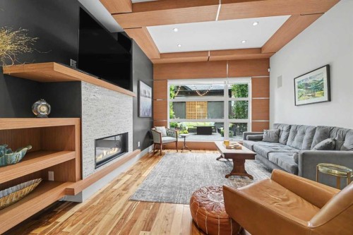 2027 42 Avenue Sw, Calgary, AB - Indoor Photo Showing Living Room With Fireplace