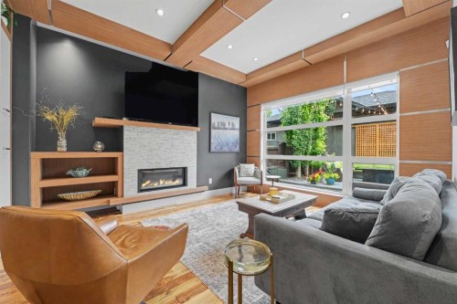 2027 42 Avenue Sw, Calgary, AB - Indoor Photo Showing Living Room With Fireplace