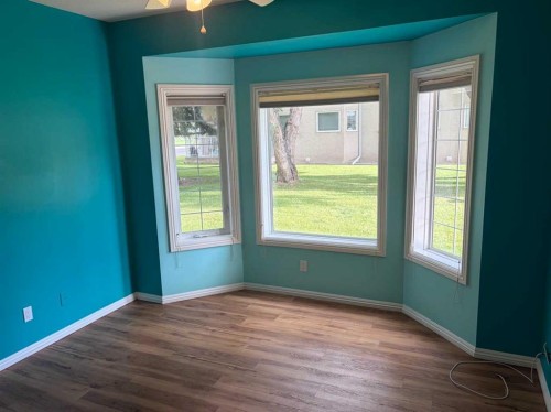 101-7 Lineham Avenue, Okotoks, AB - Indoor Photo Showing Other Room