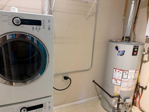 101-7 Lineham Avenue, Okotoks, AB - Indoor Photo Showing Laundry Room