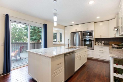24 Sun Harbour Place Se, Calgary, AB - Indoor Photo Showing Kitchen With Stainless Steel Kitchen With Upgraded Kitchen