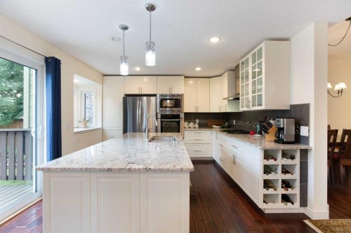 24 Sun Harbour Place Se, Calgary, AB - Indoor Photo Showing Kitchen With Upgraded Kitchen