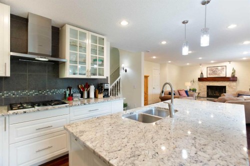 24 Sun Harbour Place Se, Calgary, AB - Indoor Photo Showing Kitchen With Double Sink With Upgraded Kitchen