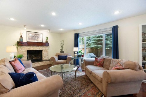24 Sun Harbour Place Se, Calgary, AB - Indoor Photo Showing Living Room With Fireplace