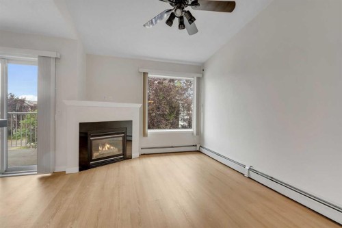 307-1307 Valleyview Park Se, Calgary, AB - Indoor Photo Showing Living Room With Fireplace