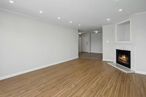 414-333 Garry Crescent Ne, Calgary, AB - Indoor With Fireplace