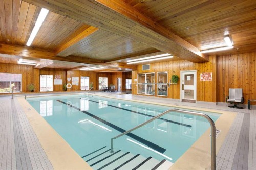239-8535 Bonaventure Drive Se, Calgary, AB - Indoor Photo Showing Other Room With In Ground Pool