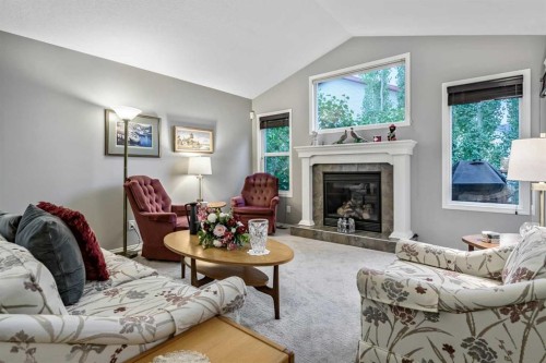 416 Silverado Range Heights Sw, Calgary, AB - Indoor Photo Showing Living Room With Fireplace