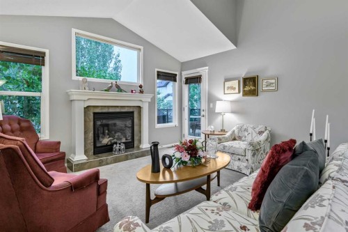 416 Silverado Range Heights Sw, Calgary, AB - Indoor Photo Showing Living Room With Fireplace