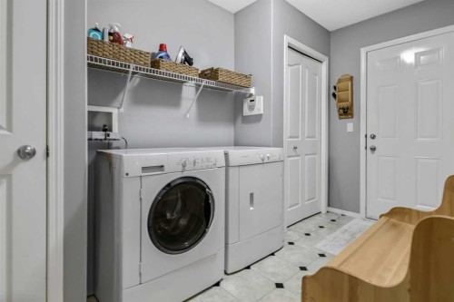 416 Silverado Range Heights Sw, Calgary, AB - Indoor Photo Showing Laundry Room